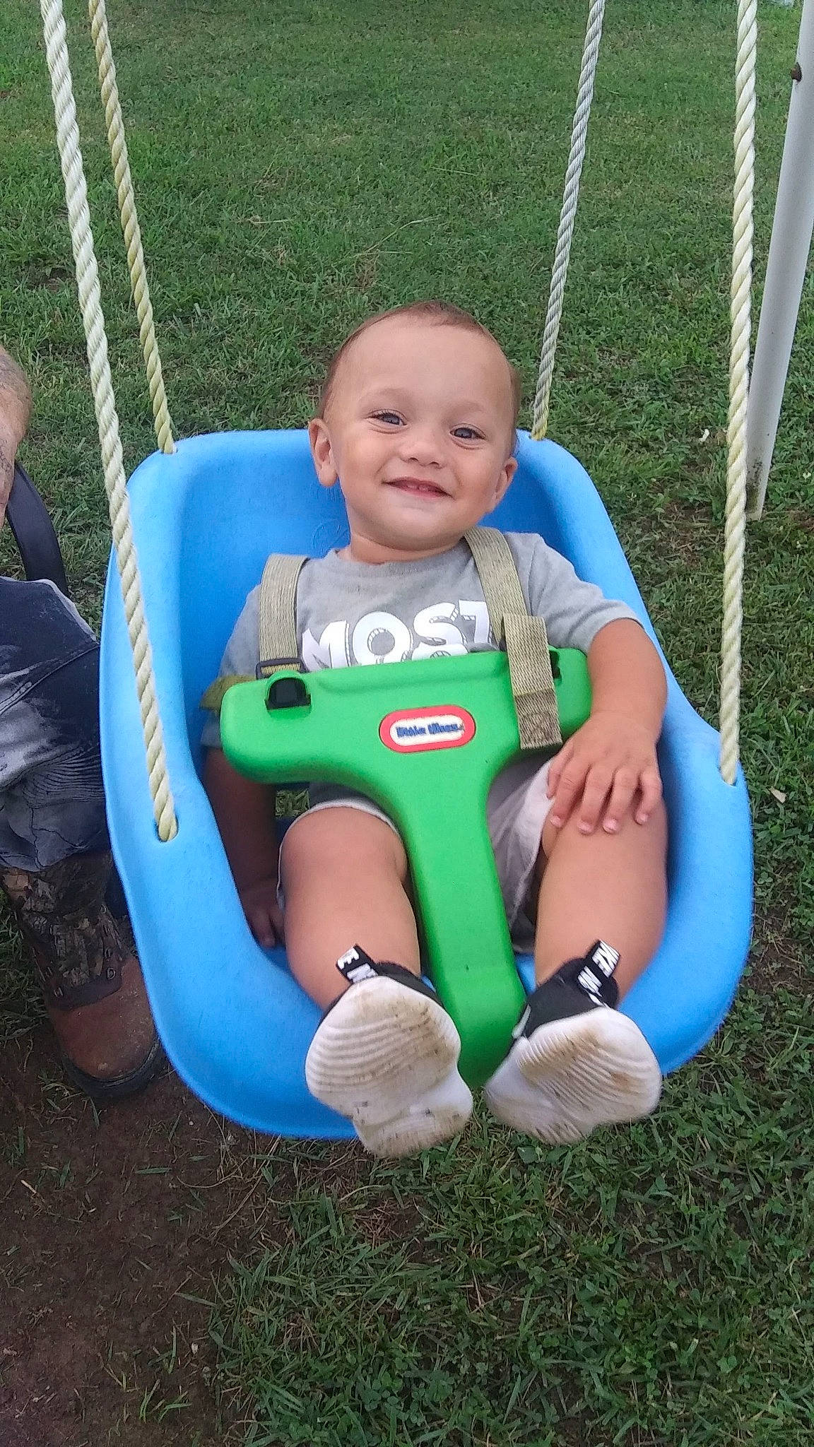 Chevy is registered to the contest to win money with this photo: baby, baby_toddler_clothing, child, city, comfort, electric_blue, fun, grass, happy, joy, knee, leisure, outdoor_play_equipment, person, play, playground, product, recreation, sitting, smile