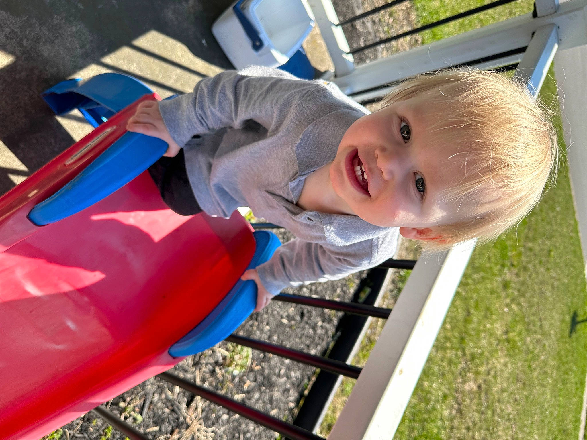 Levi is registered to the contest to win money with this photo: baby, baby_toddler_clothing, child, chute, city, electric_blue, fun, grass, happy, leisure, outdoor_play_equipment, person, play, playground, recreation, smile, t_shirt, toddler