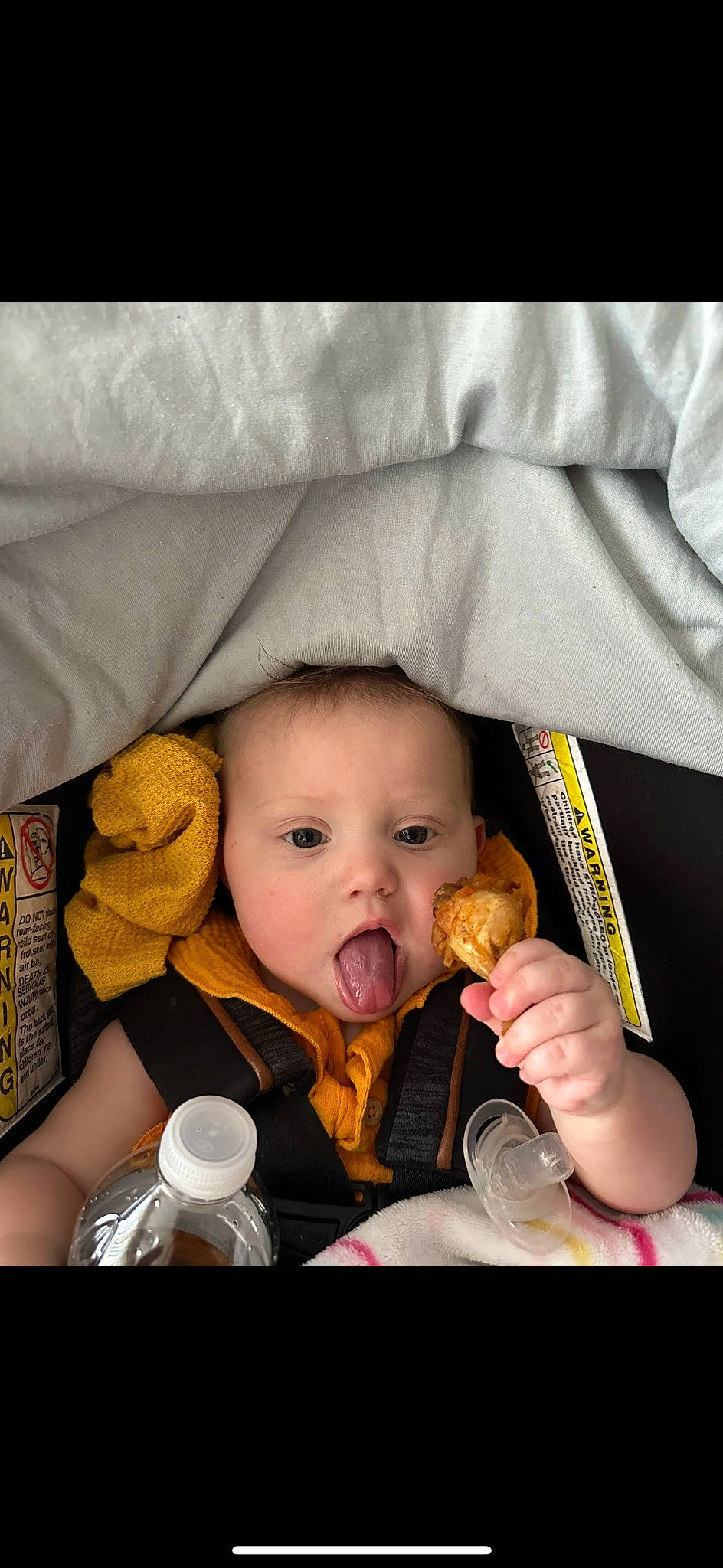 Lilly is registered to the contest to win money with this photo: baby, baby_products, baby_toddler_clothing, cheek, child, comfort, face, finger, finger_food, food, gesture, happy, linens, nose, person, sitting, skin, surprise, sweetness, tableware