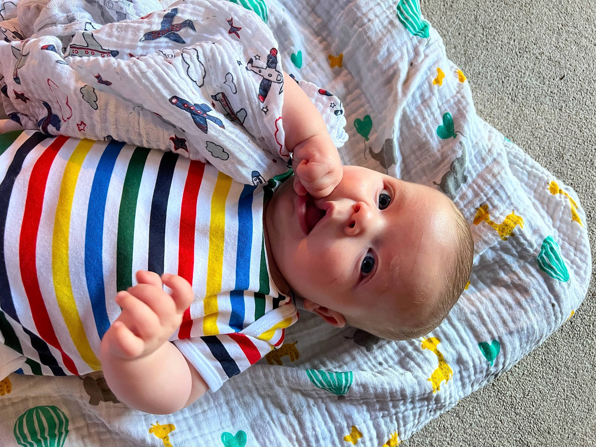 Alfie is registered to the contest to win money with this photo: art, baby, baby_products, baby_toddler_clothing, child, dress, fun, happy, leisure, linens, nail, pattern, people, person, play, product, room, sitting, sleeve, toddler