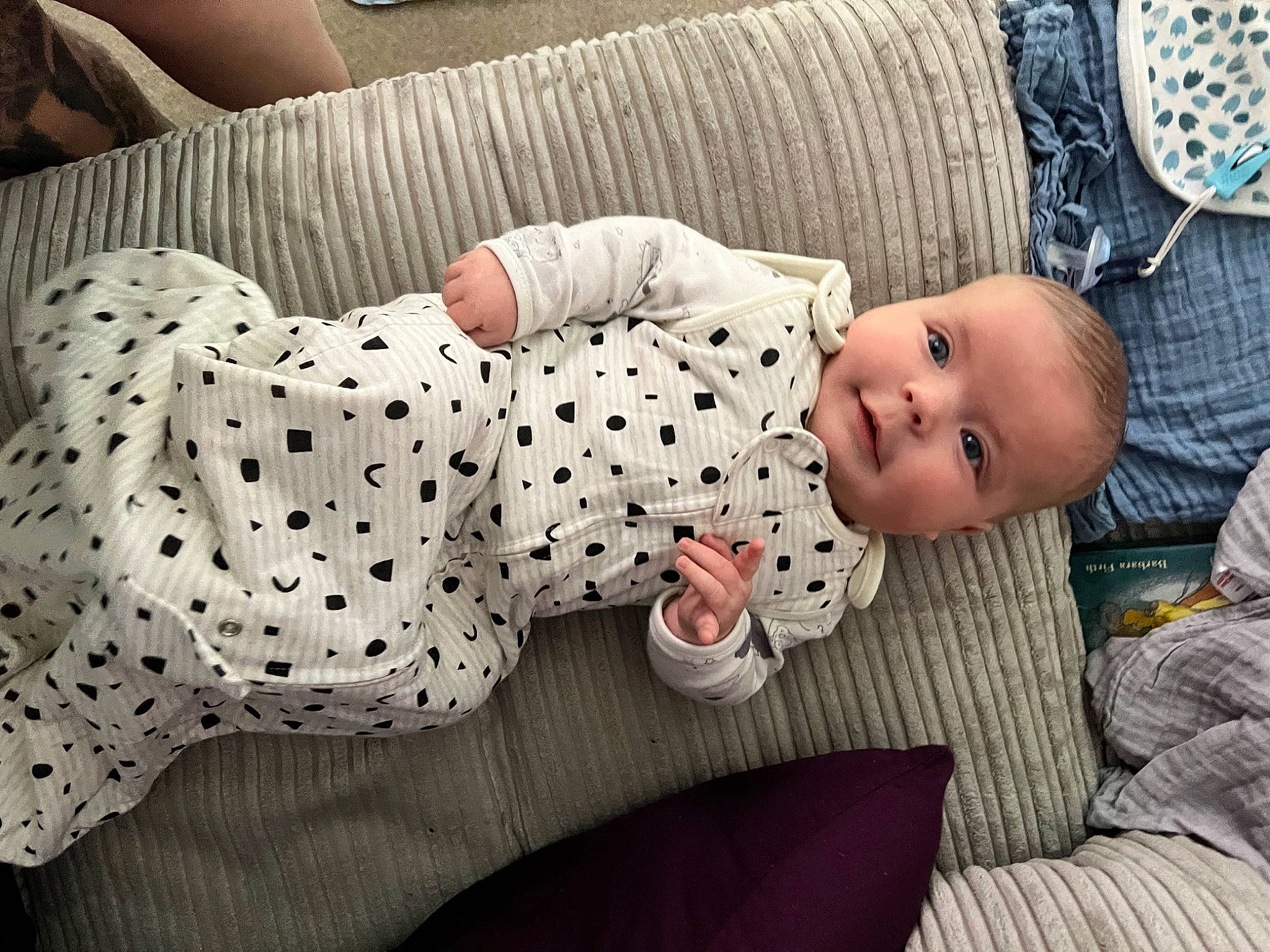Alfie is registered to the contest to win money with this photo: baby, baby_products, baby_safety, baby_sleeping, baby_toddler_clothing, child, comfort, foot, head, human_body, human_leg, linens, pattern, person, sitting, sleeve, textile, thigh, toddler, white