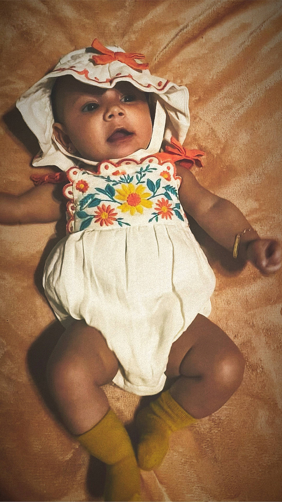 Cataleya is registered to the contest to win money with this photo: baby, baby_toddler_clothing, cheek, child, comfort, day_dress, eye, face, fashion_design, head, headwear, human_leg, iris, linens, pattern, person, petal, pink, skin, sleeve