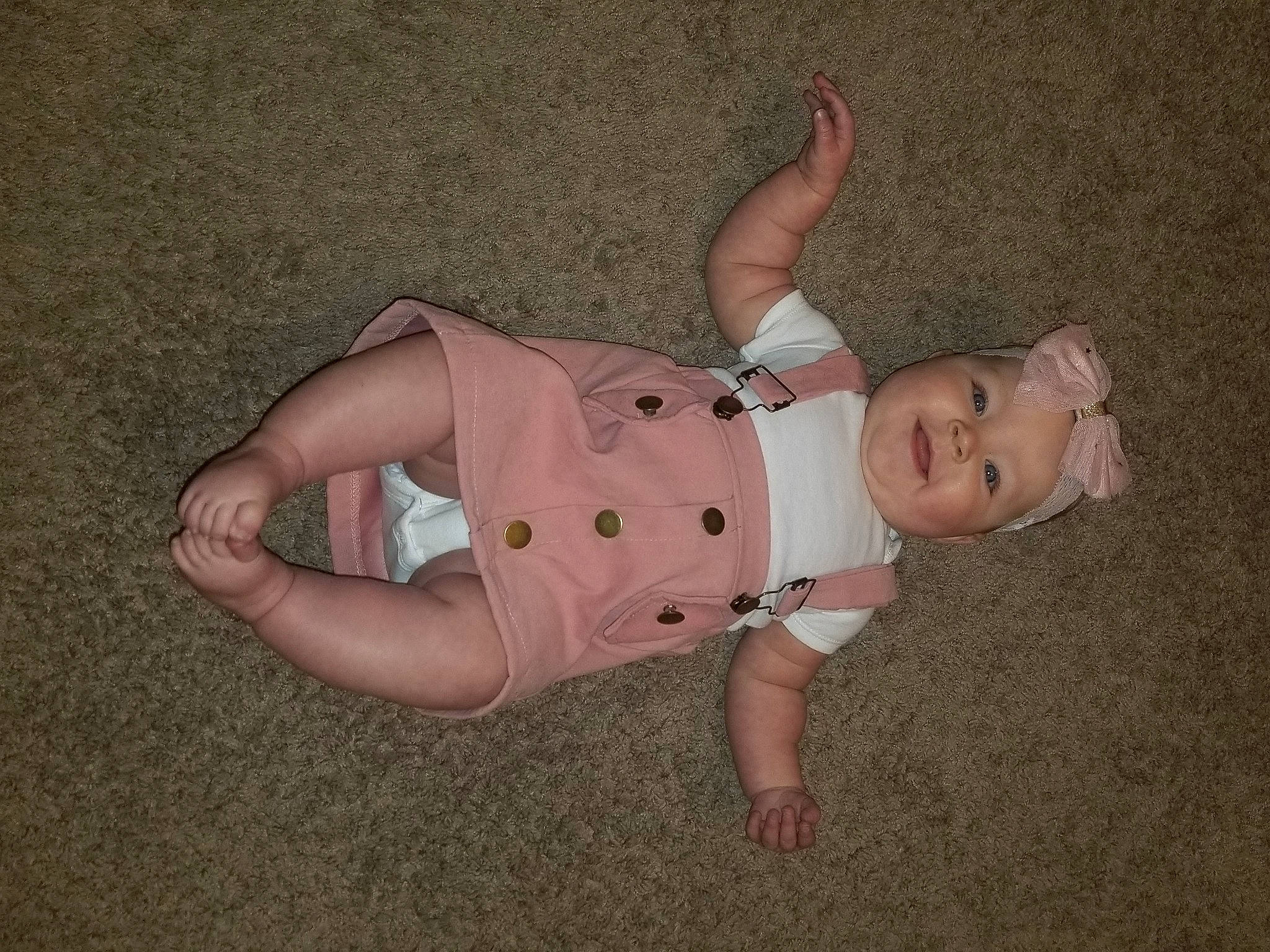 Scarlett is registered to the contest to win money with this photo: baby, baby_toddler_clothing, barefoot, cheek, elbow, finger, flooring, foot, fun, grass, headwear, human_leg, knee, leg, person, skin, sleeve, stomach, thigh, toddler