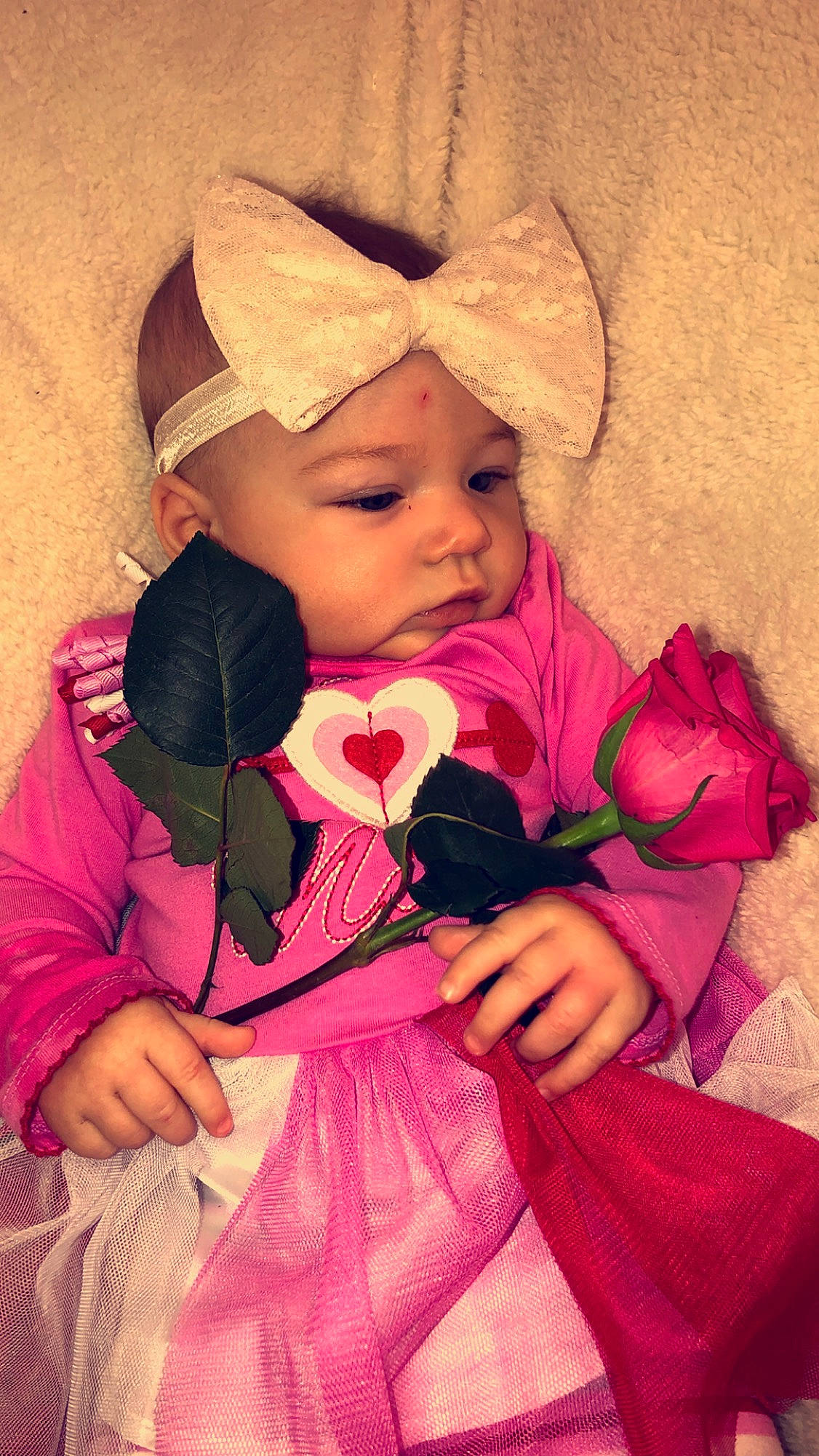 Sydney is registered to the contest to win money with this photo: baby, cheek, child, daughter, flower, happy, headwear, love, magenta, peach, person, photography, pink, plant, smile, toddler