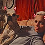 brown_dog, casual_clothing, clock, couch, dog, filter, furniture, indoors, living_room, neon_horns, person, pet, portrait, red_curtains, relaxing, selfie, short_hair, smiling, vintage_filter, warm_lighting