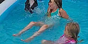 Thunder joined the competition — help win amazing prizes! child, children, dog, pool, water, splashing, summer, outdoor, play, fun, happy, swimming, inflatable_pool, blue, fence, pet, animal, girl, wet, leisure