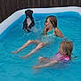 child, children, dog, pool, water, splashing, summer, outdoor, play, fun, happy, swimming, inflatable_pool, blue, fence, pet, animal, girl, wet, leisure