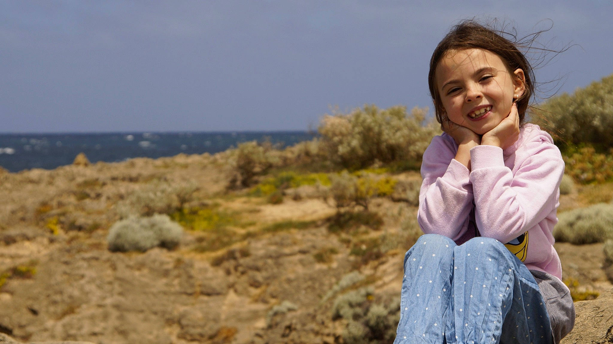 Lilly-rose joined the competition — help win amazing prizes! beauty, coast, coastal_and_oceanic_landforms, eye, fun, happy, head, joy, leisure, ocean, person, photograph, photography, rock, sea, shore, sitting, smile, summer, tourism