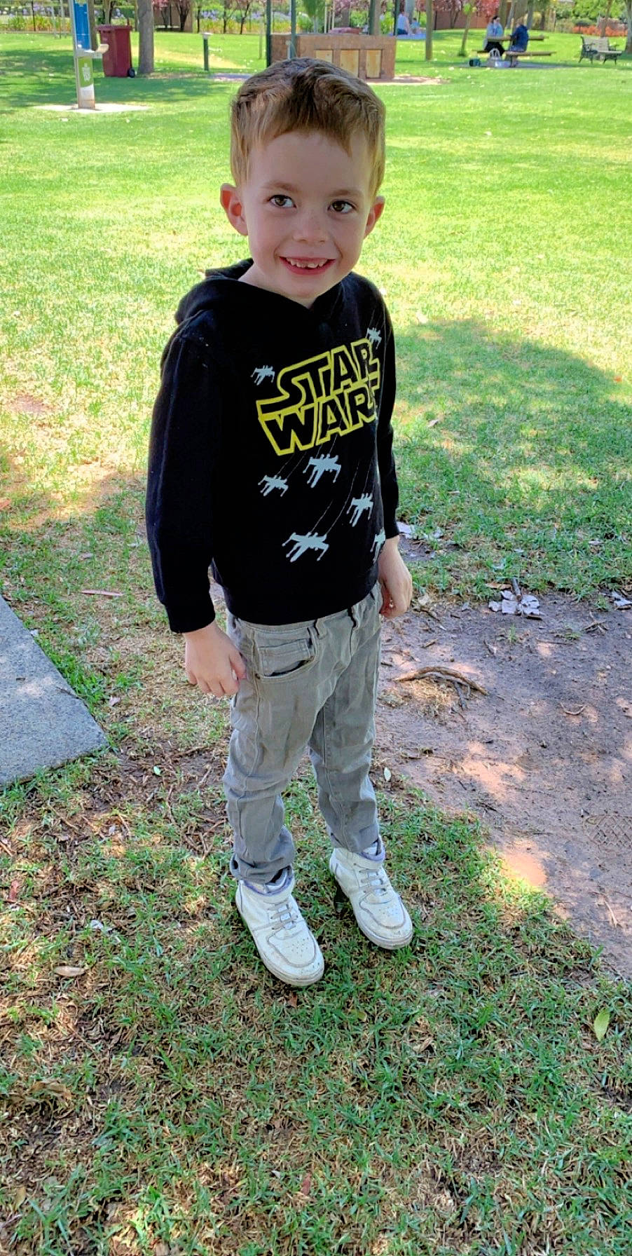 Lucas is registered to the contest to win money with this photo: child, cool, fun, grass, jeans, joy, lawn, outerwear, person, sleeve, t_shirt, toddler, top, walking