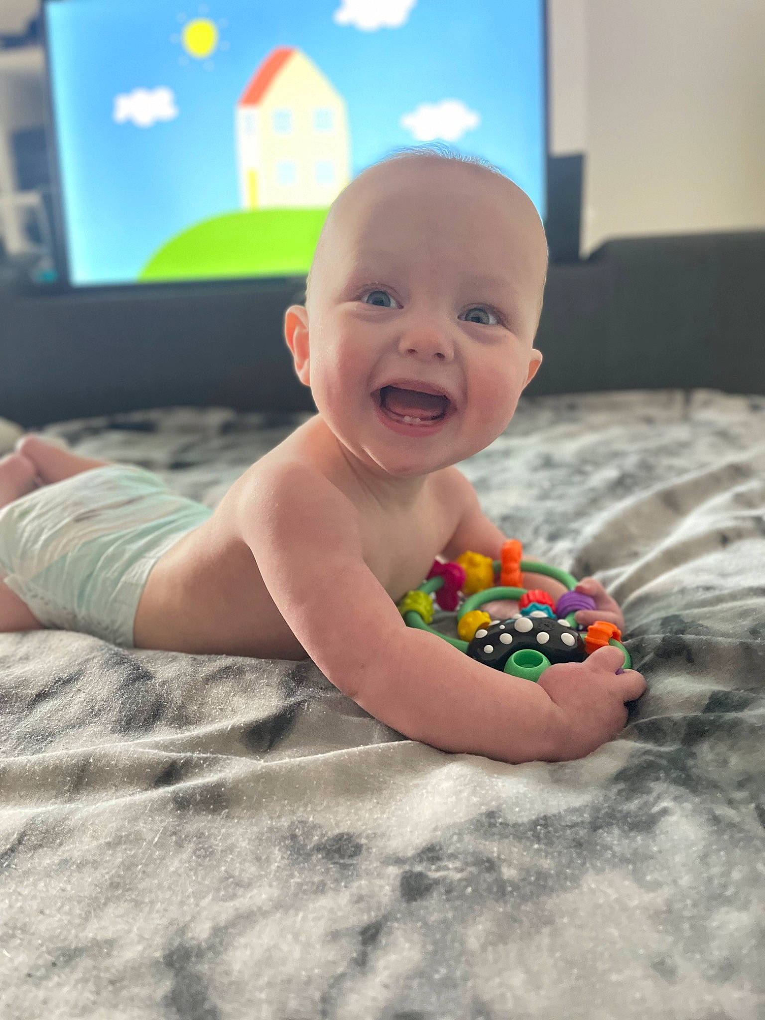 Noah joined the competition — help win amazing prizes! baby, baby_playing_with_toys, baby_products, baby_toys, child, crawling, display_device, facial_expression, floor, flooring, fun, happy, leisure, person, play, room, sitting, smile, toddler, toy