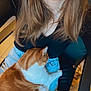 affection, black_top, blue_jeans, casual, cat, chair, comfort, furniture, happy, home, indoor, lap, long_hair, orange_cat, person, pet, relaxed, seated, smile, white_cat