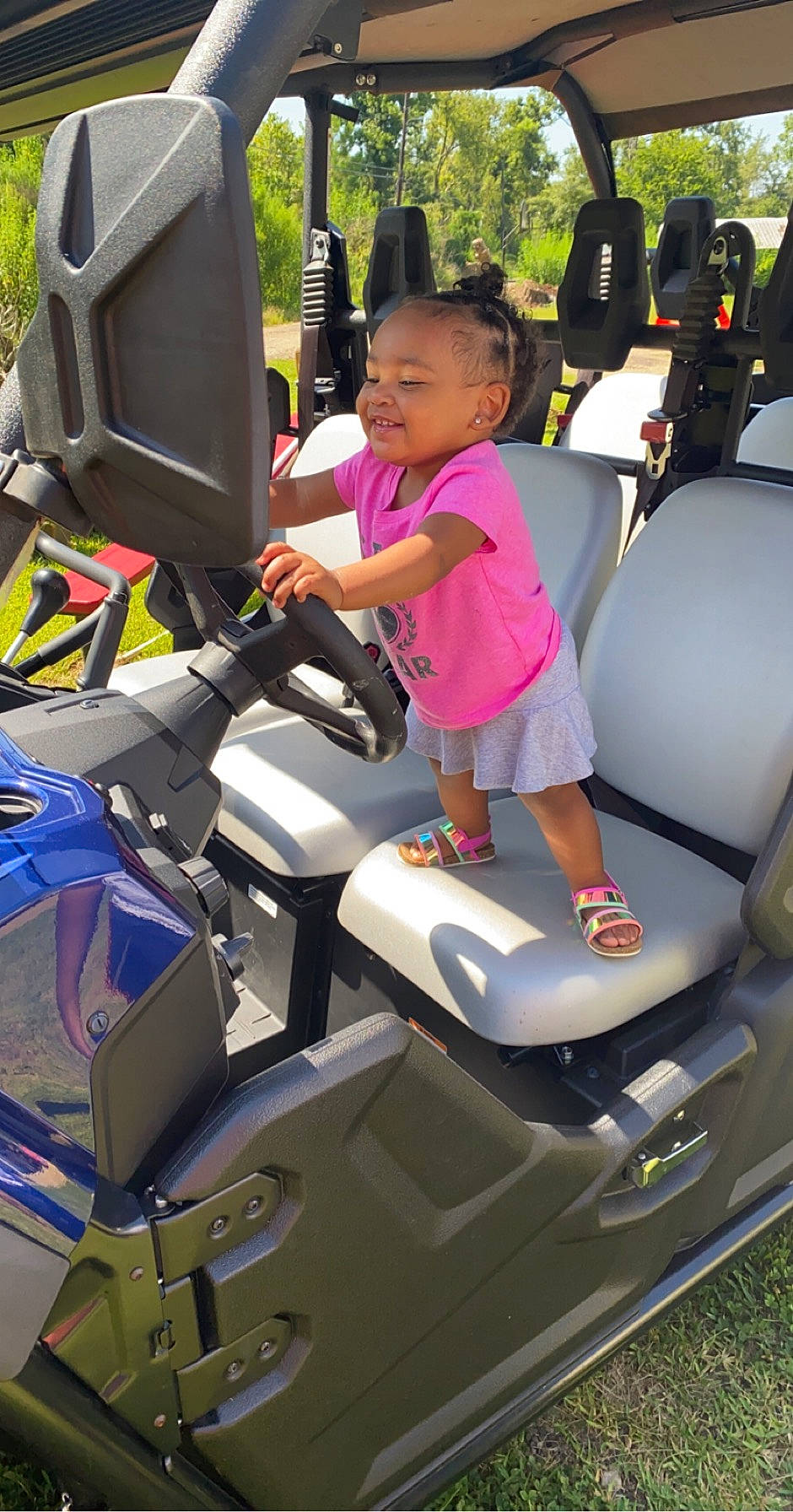 Amayah is registered to the contest to win money with this photo: amusement_park, baby, car_seat, child, joy, lap, machine, park, person, plastic, play, playground, riding_toy, toddler