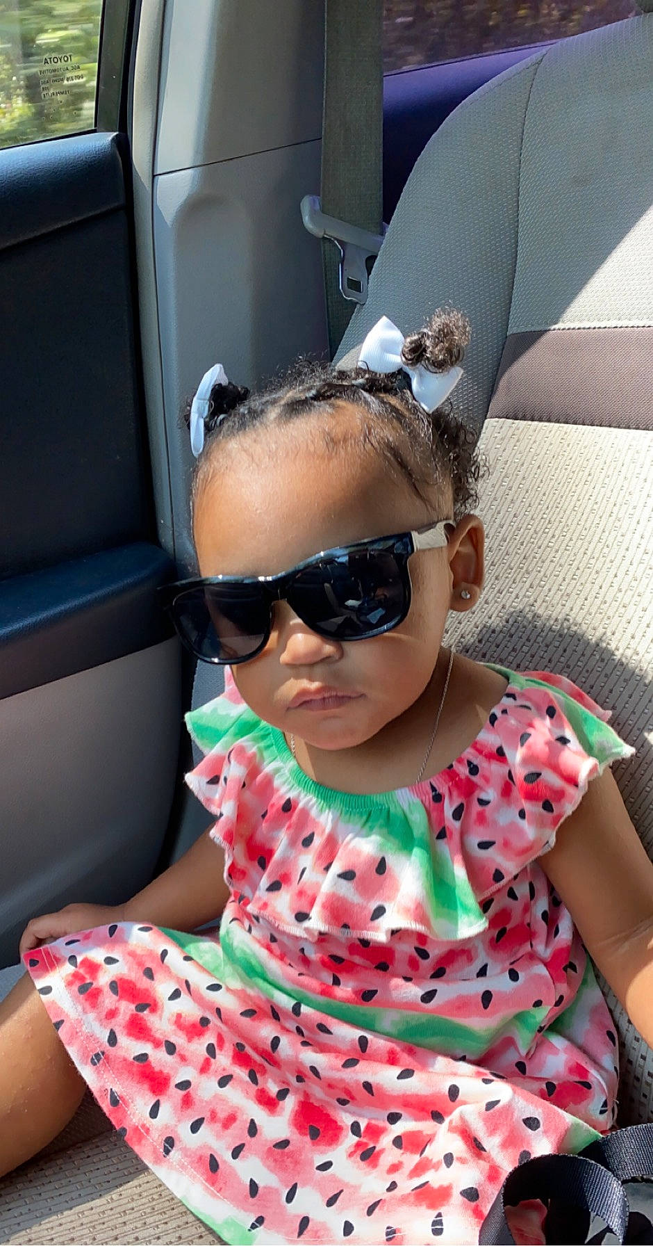 Amayah joined the competition — help win amazing prizes! baby_toddler_clothing, bracelet, car_seat, cool, eyewear, glasses, goggles, mammal, mouth, overall, pattern, person, pink, polka_dot, sitting, sunglasses, toddler, vehicle_door, vision_care