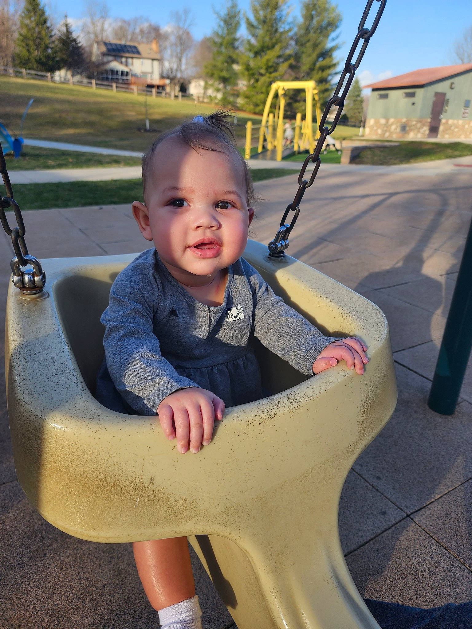 Ezra joined the competition — help win amazing prizes! baby, baby_toddler_clothing, chin, city, eye, face, fun, grass, happy, leisure, outdoor_play_equipment, person, plant, playground, recreation, skin, sky, smile, swing, toddler