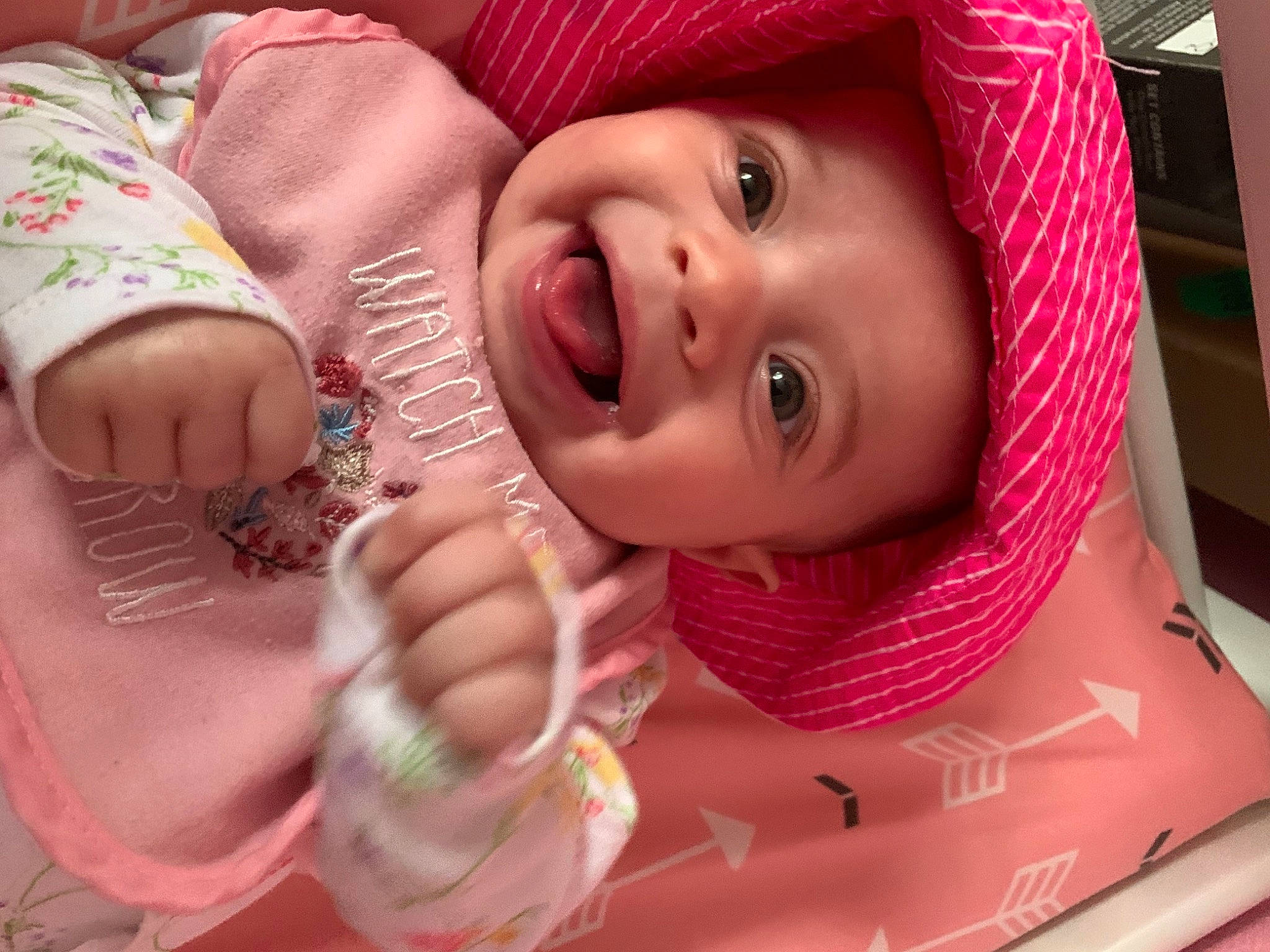 Leila is registered to the contest to win money with this photo: baby, cap, cheek, chin, drinkware, eye, eyebrow, eyelash, face, facial_expression, happy, headgear, headwear, iris, joy, lip, mouth, nose, person, pink
