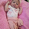 Oakie is registered to the contest to win money with this photo: baby, infant, child, portrait, lying_down, pink_blanket, bow_headband, bow_outfit, baby_clothing, floral_pattern, cute, awake, facial_expression, hands, arms, legs, indoor, soft_blanket, close_up, photography