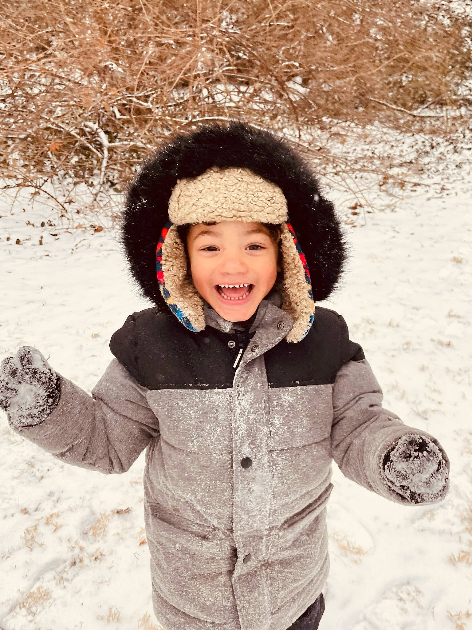 Jaden joined the competition — help win amazing prizes! cool, flash_photography, freezing, fun, gesture, happy, headgear, headwear, human_body, jacket, joy, outerwear, parka, people_in_nature, person, skin, smile, snow, standing, toddler