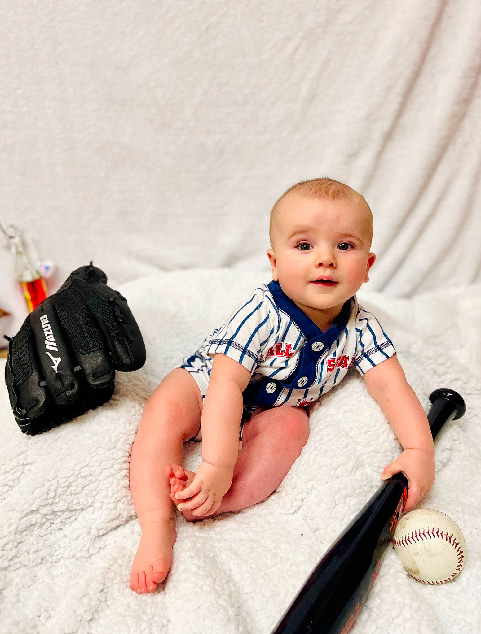 Timothy joined the competition — help win amazing prizes! baby, baby_toddler_clothing, bag, barefoot, child, comfort, fashion_accessory, flash_photography, flooring, foot, fun, happy, human_leg, knee, luggage_and_bags, pattern, person, sitting, sleeve, thigh