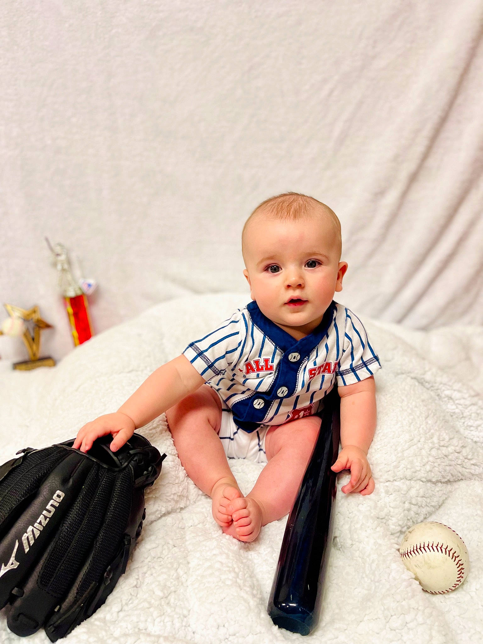 Timothy joined the competition — help win amazing prizes! baby, baby_toddler_clothing, bag, child, fashion_accessory, fashion_design, flooring, foot, happy, human_leg, knee, pattern, person, portrait_photography, room, sitting, sleeve, t_shirt, toddler, waist