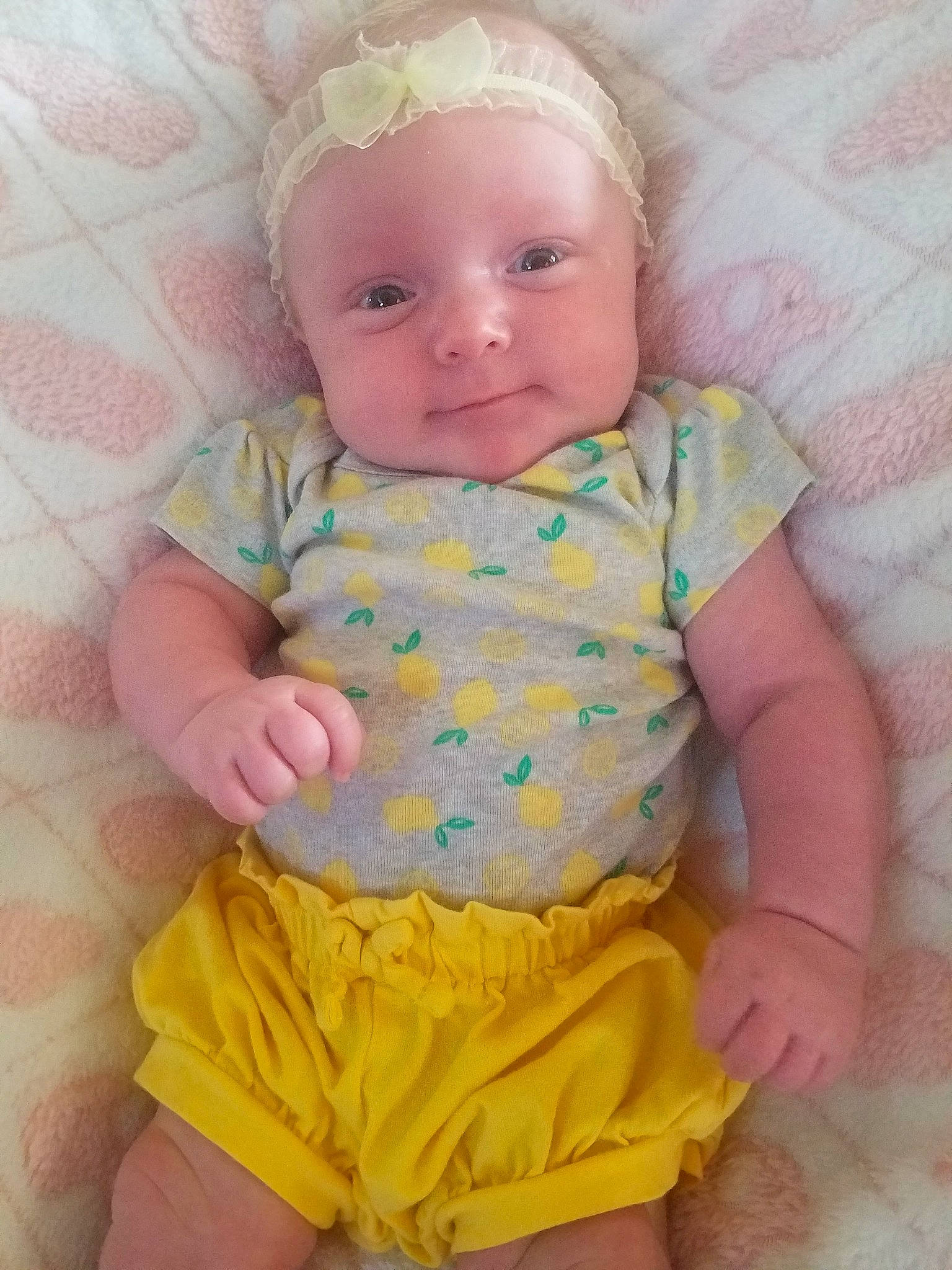 Elodie is registered to the contest to win money with this photo: baby, baby_products, baby_toddler_clothing, cheek, child, pattern, person, pink, product, skin, toddler, yellow