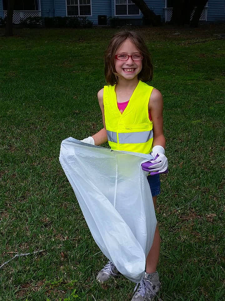 Isabella is registered to the contest to win money with this photo: costume, dress, fun, grass, joy, person, yellow