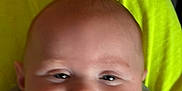Kayson is registered to the contest to win money with this photo: baby, infant, smile, face, chubby_cheeks, close_up, child, young, clothing, striped_shirt, yellow_background, happy, portrait, person, cute, skin, head, eyes, mouth, expression