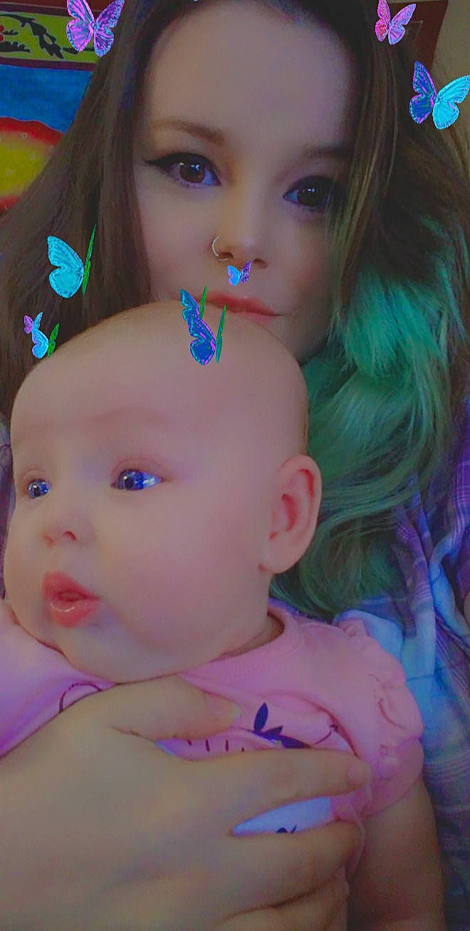 Santana is registered to the contest to win money with this photo: baby_toddler_clothing, blue, cheek, chin, close_up, eye, eyebrow, eyelash, forehead, gesture, hair, hairstyle, happy, head, iris, lip, mouth, nose, person, pink