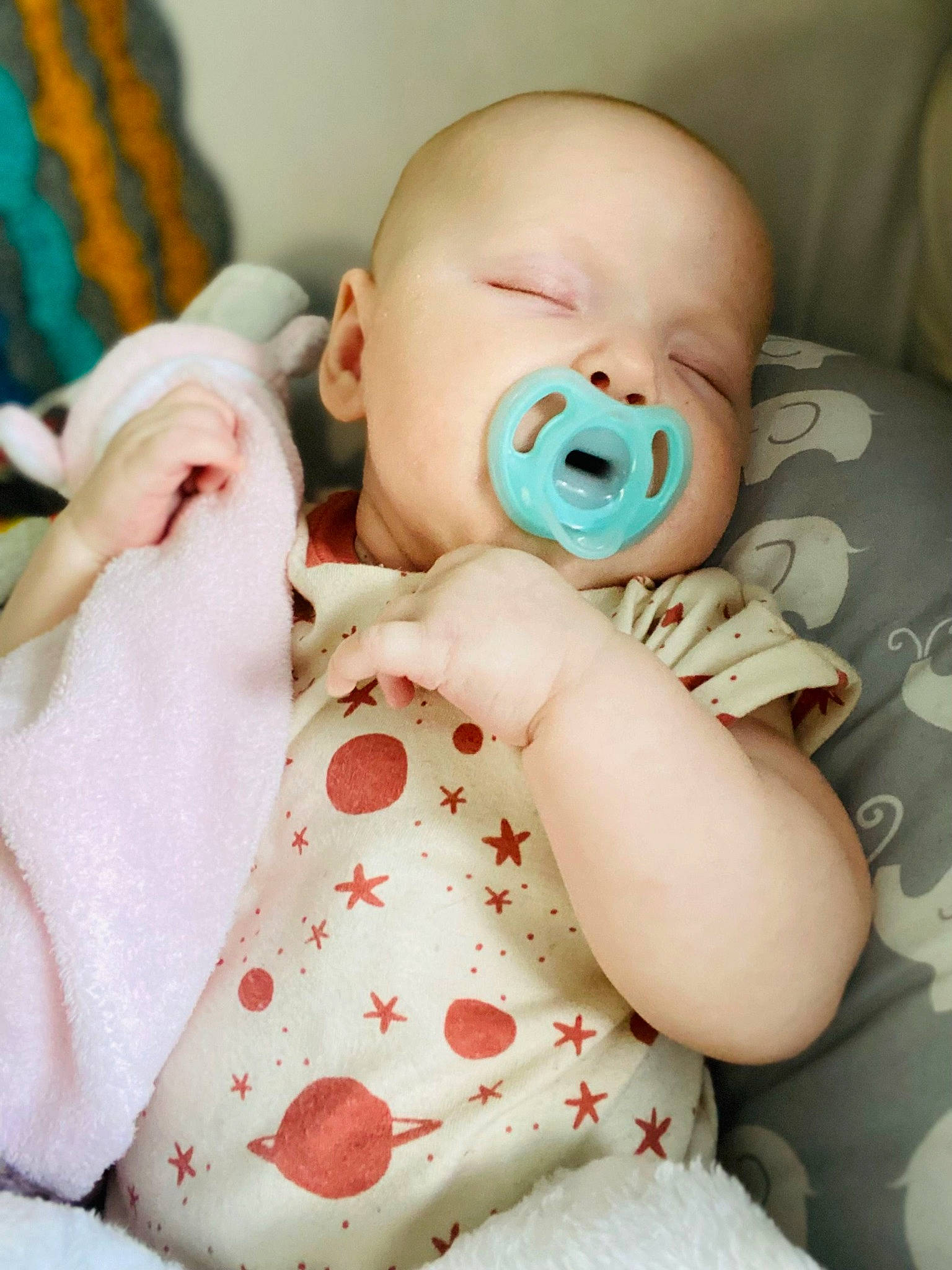 Santana is registered to the contest to win money with this photo: baby, baby_products, baby_sleeping, baby_toddler_clothing, cheek, child, comfort, eye, happy, head, joint, linens, lip, mouth, nose, person, pink, skin, sleeve, toddler