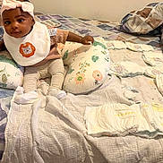 Najibat joined the competition — help win amazing prizes! baby, child, infant, bow, bib, lion, pillow, diapers, bed, blanket, striped_pants, socks, smile, indoor, cute, young_child, cloth, fabric, person, resting