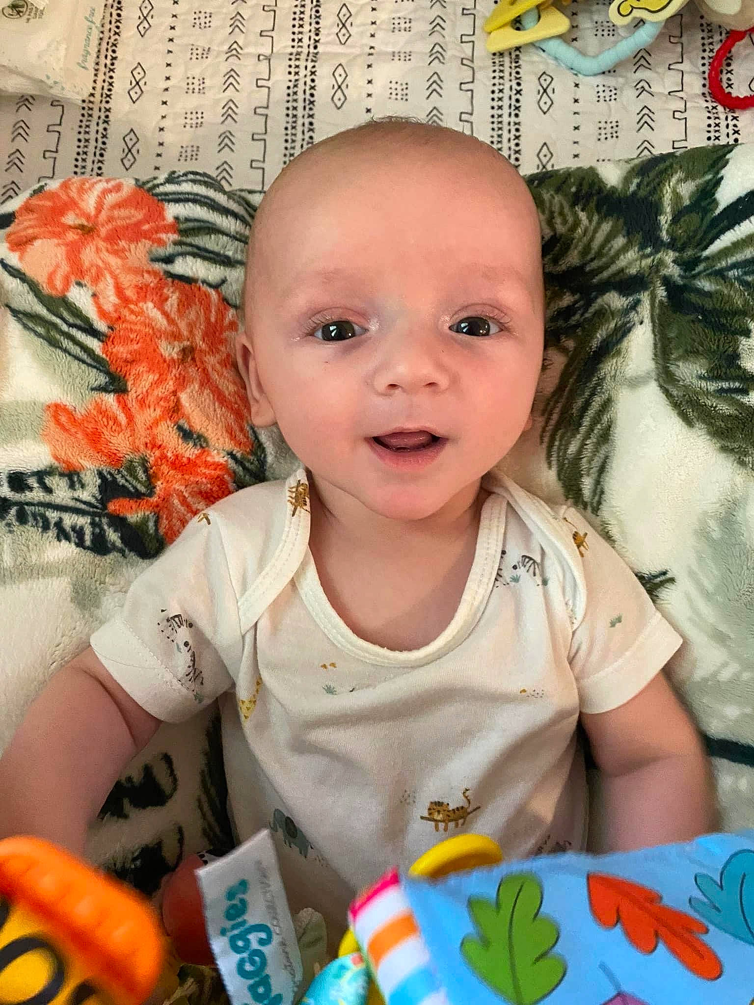 Dawson is registered to the contest to win money with this photo: baby, baby_toddler_clothing, cheek, eye, eyebrow, eyelash, face, finger, green, happy, iris, mouth, nose, person, product, skin, sleeve, smile, t_shirt, toddler