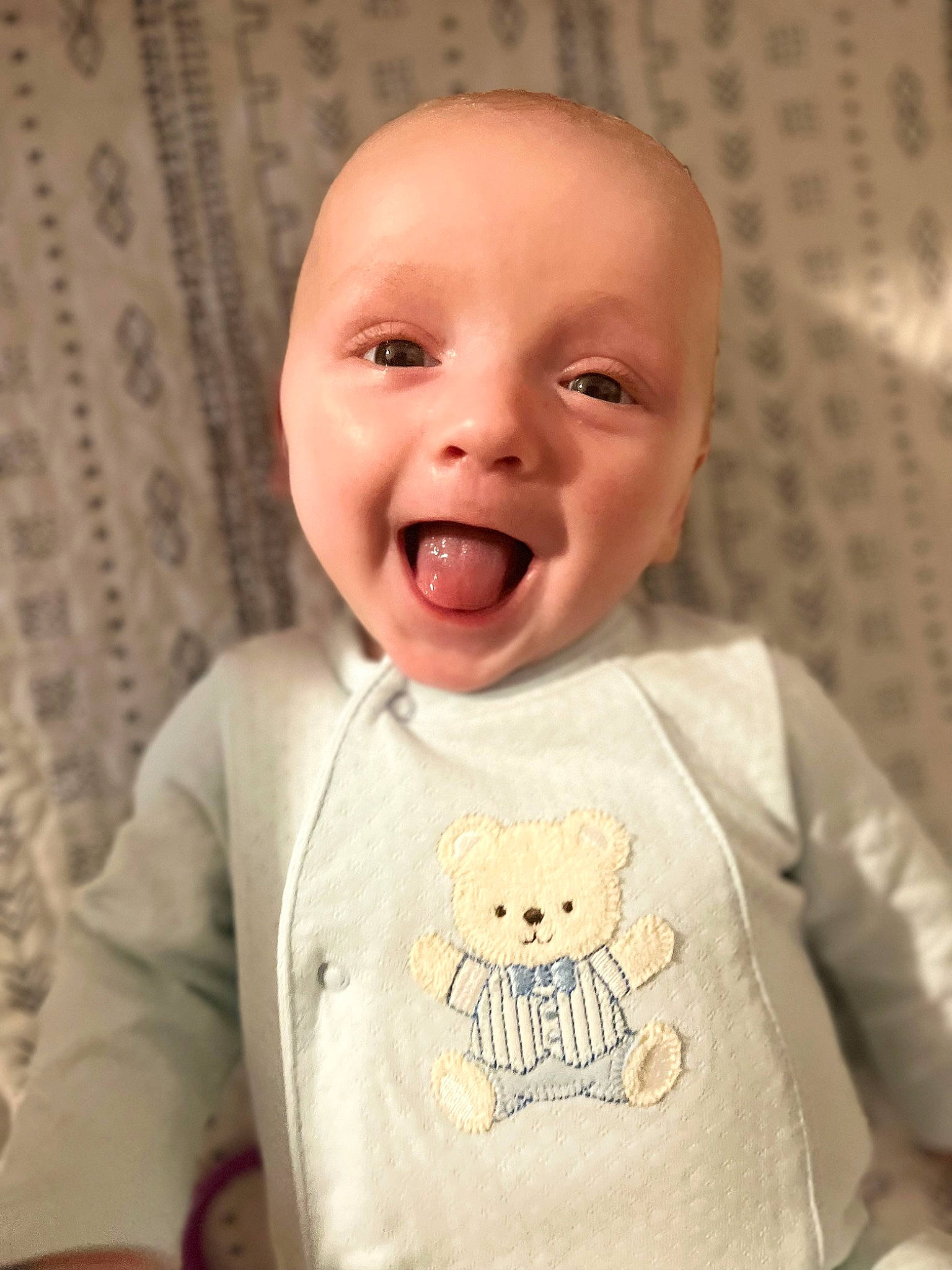 Dawson joined the competition — help win amazing prizes! baby, baby_toddler_clothing, cheek, child, comfort, eye, facial_expression, happy, head, laugh, linens, mammal, nose, outerwear, pattern, person, skin, sleeve, smile, t_shirt