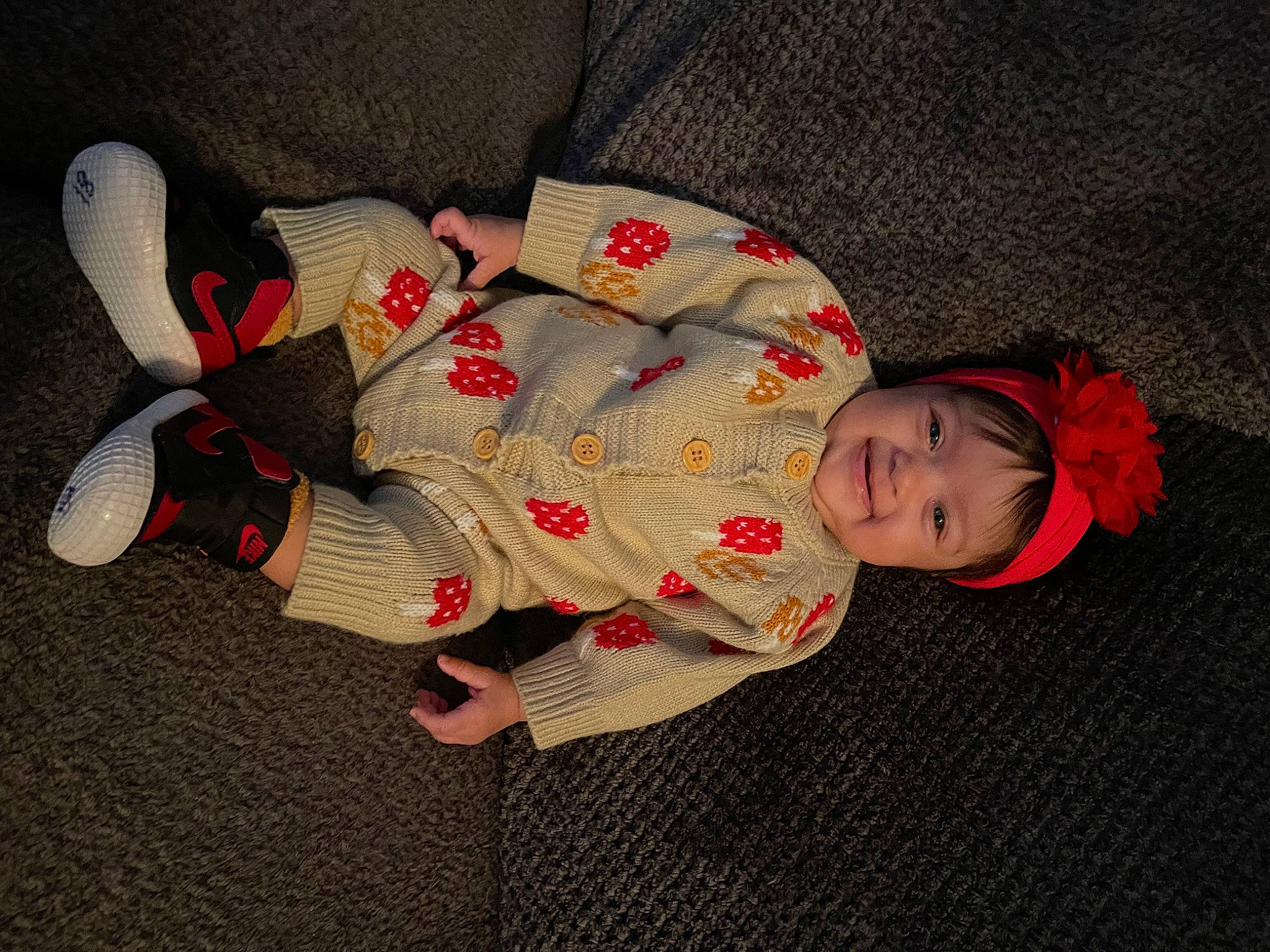 Brynleigh is registered to the contest to win money with this photo: baby, baby_products, baby_toddler_clothing, carmine, child, comfort, flooring, foot, headwear, joy, lap, linens, mammal, pattern, person, petal, sitting, skin, sleeve, sock