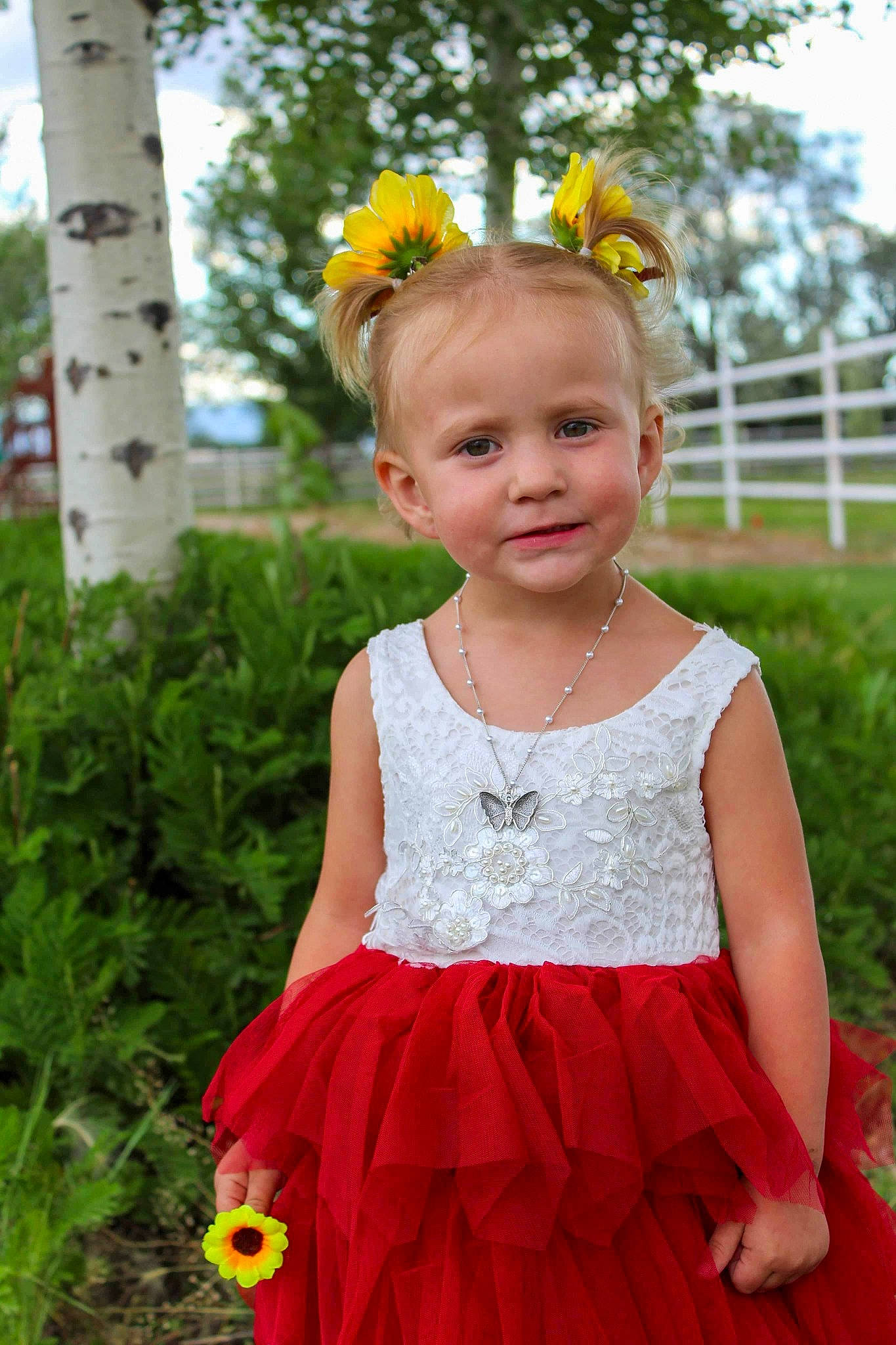 Harper is registered to the contest to win money with this photo: baby_toddler_clothing, bridal_party_dress, child, clothing, day_dress, embellishment, facial_expression, grass, hairstyle, happy, joy, one_piece_garment, people_in_nature, person, pink, plant, sky, summer, toddler, tree