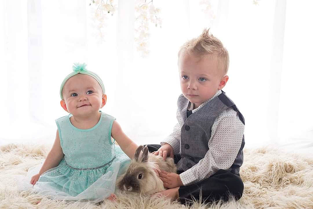 Harper is registered to the contest to win money with this photo: baby, baby_toddler_clothing, carnivore, comfort, companion_dog, dog, eye, flash_photography, fun, gesture, grass, happy, interaction, joy, leisure, people_in_nature, person, skin, smile, standing