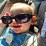 Arya a rejoint le concours — aidez-le/la à gagner de superbes lots ! baby, sunglasses, car_seat, denim_overalls, pacifier, smile, child, sunlight, seatbelt, cute, happy, infant, clothing, accessory, indoors, portrait, casual, face, head, baby_toy