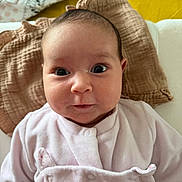 Célia participe au concours pour gagner de l'argent avec cette photo : baby, infant, face, eyes, clothing, blanket, pink, yellow, portrait, cute, child, closeup, newborn, soft, warm, expression, person, indoors, head, smile