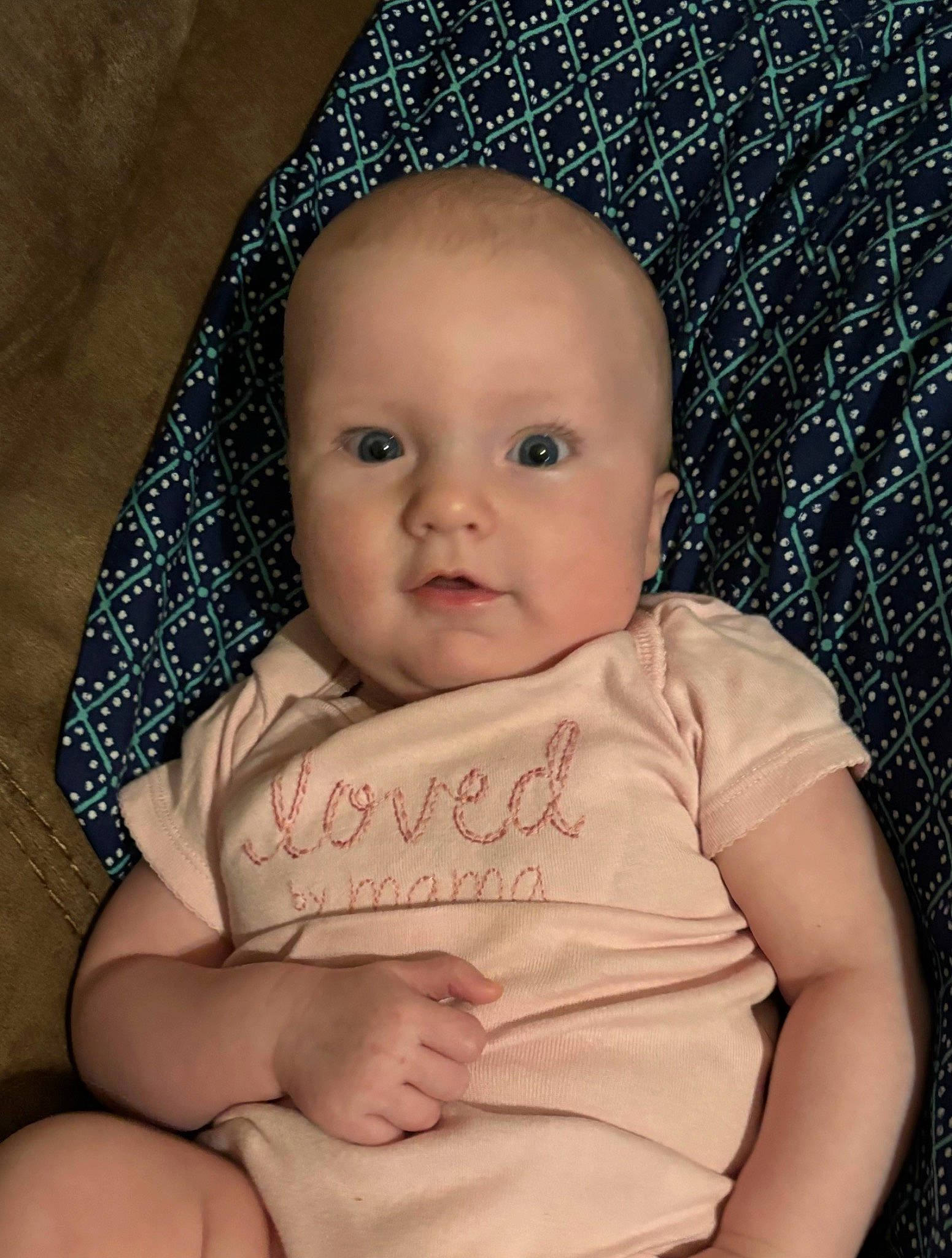 Megan is registered to the contest to win money with this photo: baby, baby_toddler_clothing, cheek, chin, comfort, eye, eyebrow, face, head, human_body, iris, lip, mouth, nose, person, skin, sleeve, smile, stomach, textile