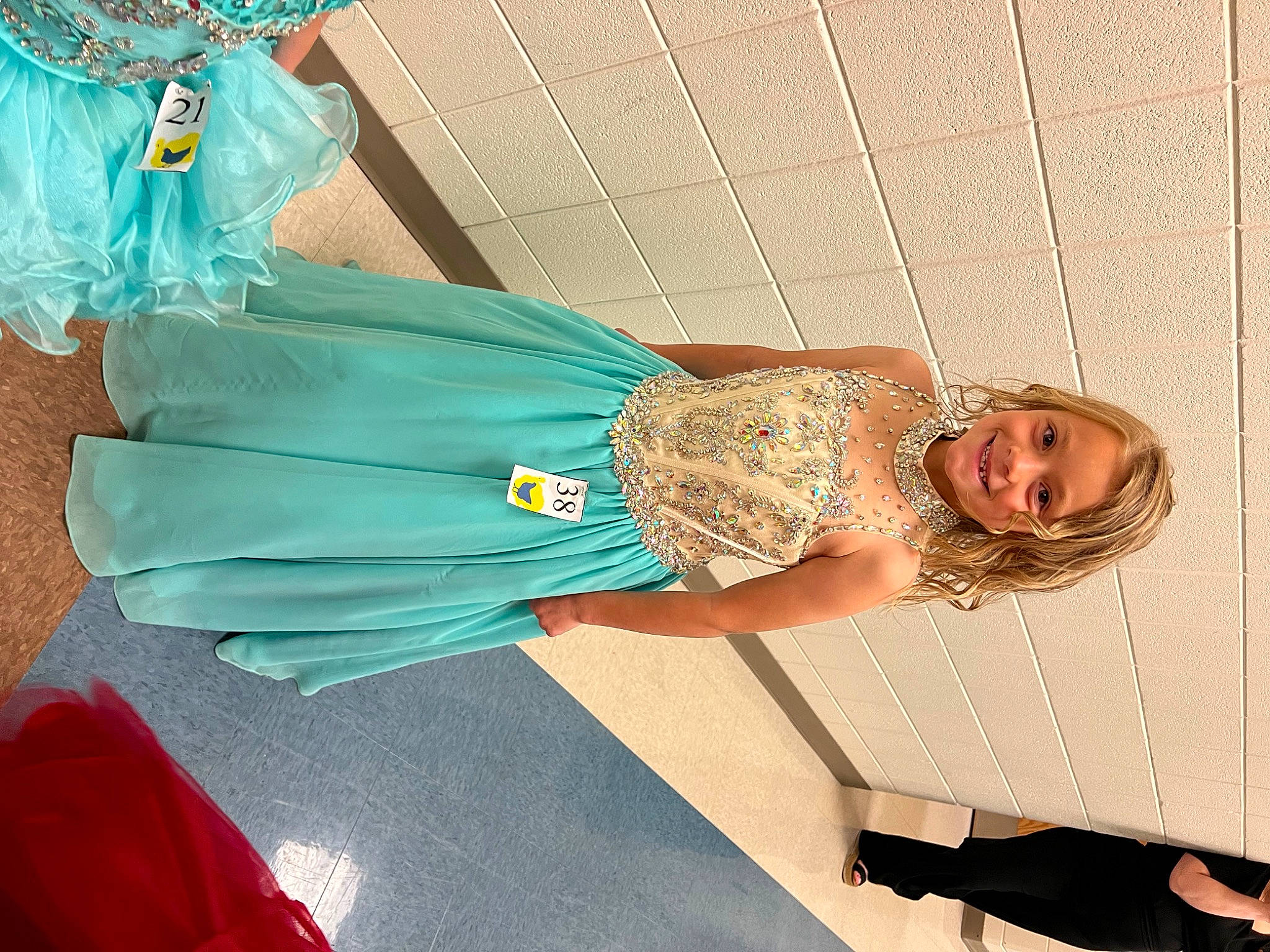 Kristlynn joined the competition — help win amazing prizes! costume, dress, electric_blue, event, fashion_accessory, fashion_design, fun, happy, human_leg, jewellery, joy, knee, magenta, pattern, peach, person, pink, sitting, smile, thigh