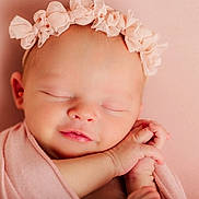Grace is registered to the contest to win money with this photo: newborn, baby, sleeping, pink, headband, flower, wrapped, blanket, soft, peaceful, infant, cute, portrait, closeup, child, skin, hands, resting, face, adorable