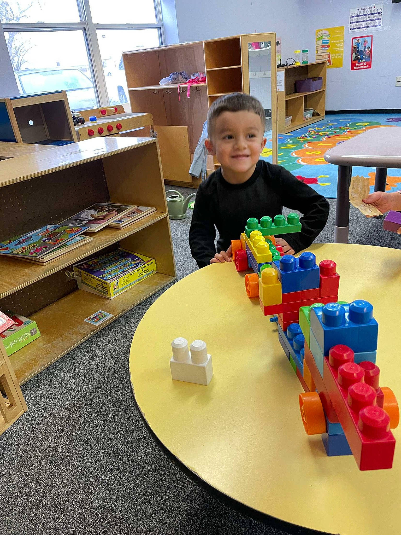 Andres joined the competition — help win amazing prizes! chair, child, design, desk, educational_toy, engineering, flooring, fun, furniture, joy, learning, leisure, person, plastic, play, recreation, room, science, sharing, table