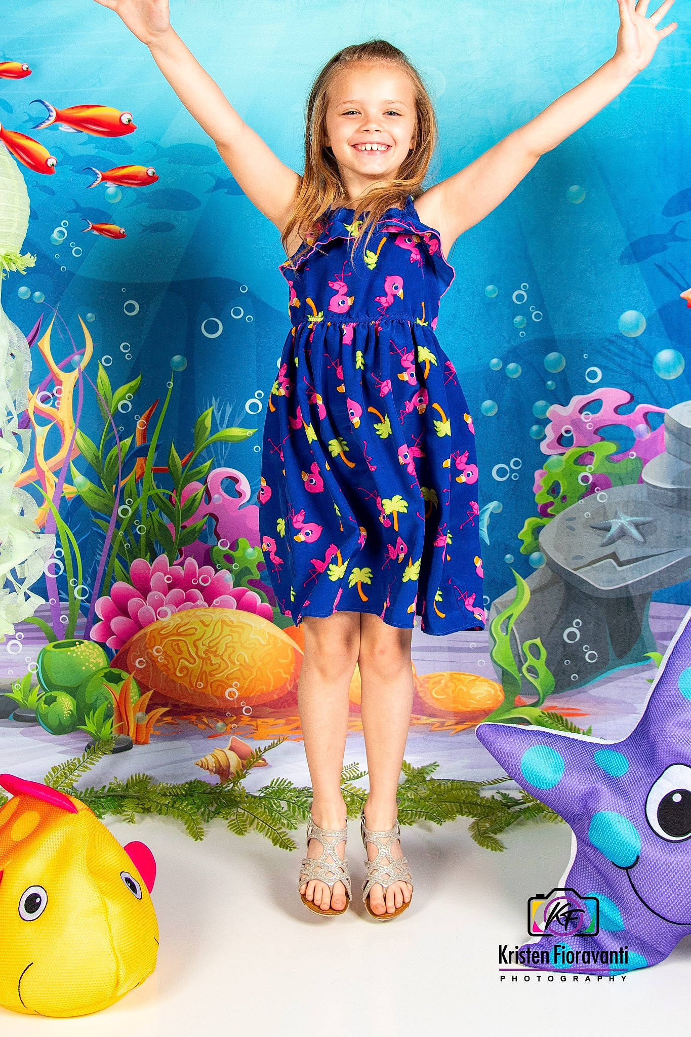 Lillian is registered to the contest to win money with this photo: child, electric_blue, event, fish, fun, happy, human_leg, joy, leisure, one_piece_garment, organism, pattern, people_in_nature, person, photograph, pink, purple, smile, snapshot, toddler