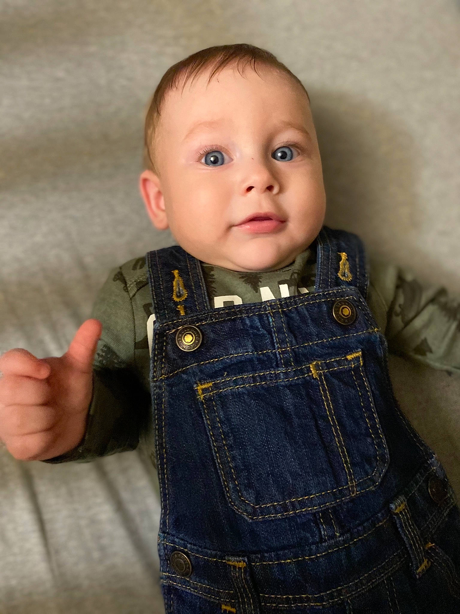 Alexei is registered to the contest to win money with this photo: baby, baby_toddler_clothing, cheek, clothing, collar, embellishment, eye, eyelash, face, gesture, iris, lip, nose, outerwear, pattern, person, skin, sleeve, toddler, wool