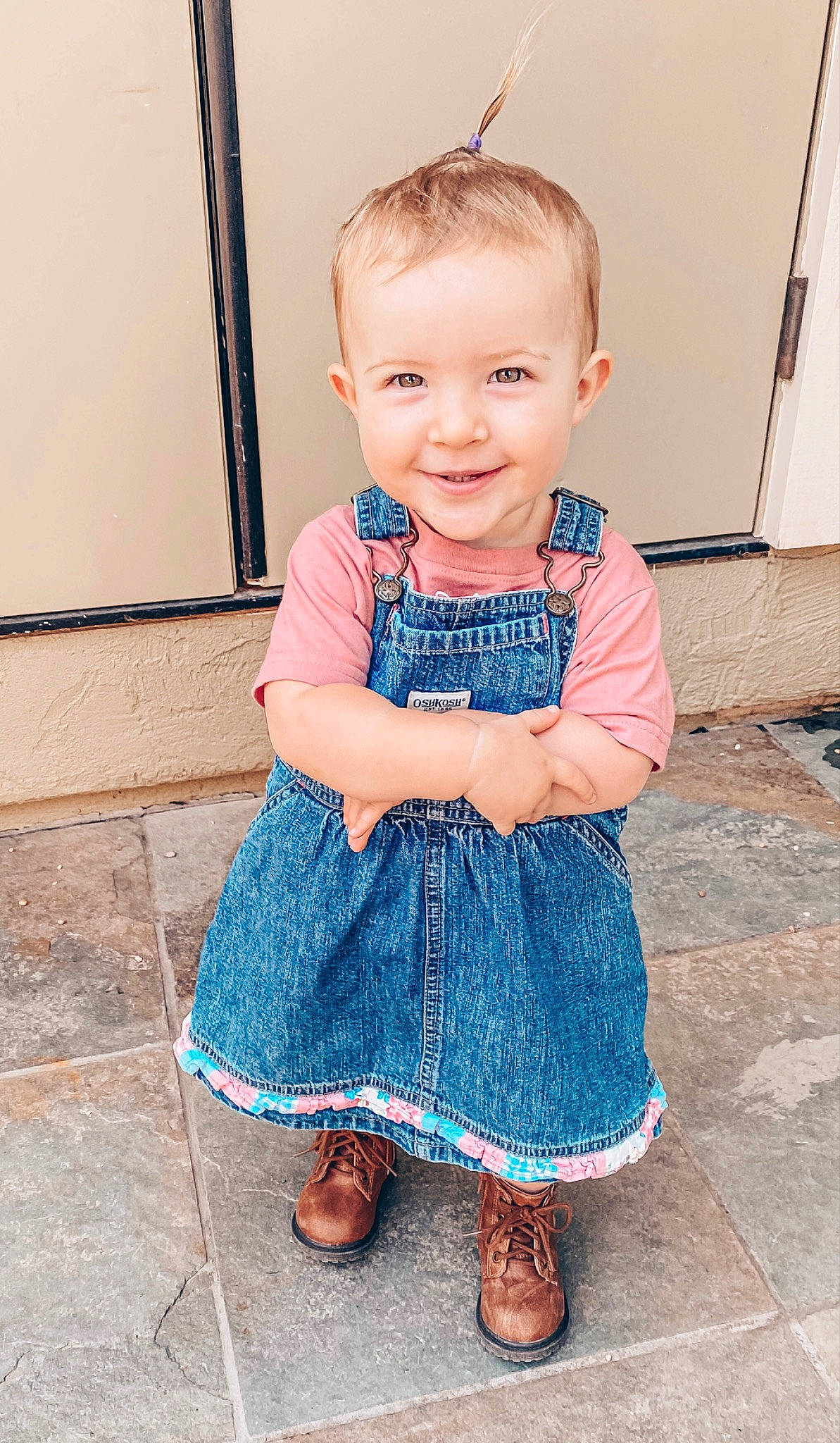 Wrenley is registered to the contest to win money with this photo: arm, azure, baby_toddler_clothing, blue, clothing, dress, eye, face, hand, happy, human_body, iris, joy, leg, person, shoulder, skin, sleeve, smile, standing