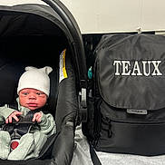 Markus joined the competition — help win amazing prizes! baby, backpack, black, bundle, car_seat, child, clothing, comfortable, cute, expression, face, hat, indoor, infant, newborn, person, seatbelt, small, soft, text