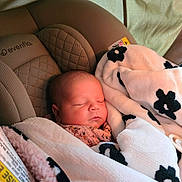 Cassidy joined the competition — help win amazing prizes! baby, sleeping, blanket, car_seat, evenflo, infant, soft, cozy, resting, child, cute, peaceful, face, head, wrapped, pink_clothing, indoor, portrait, newborn, fabric