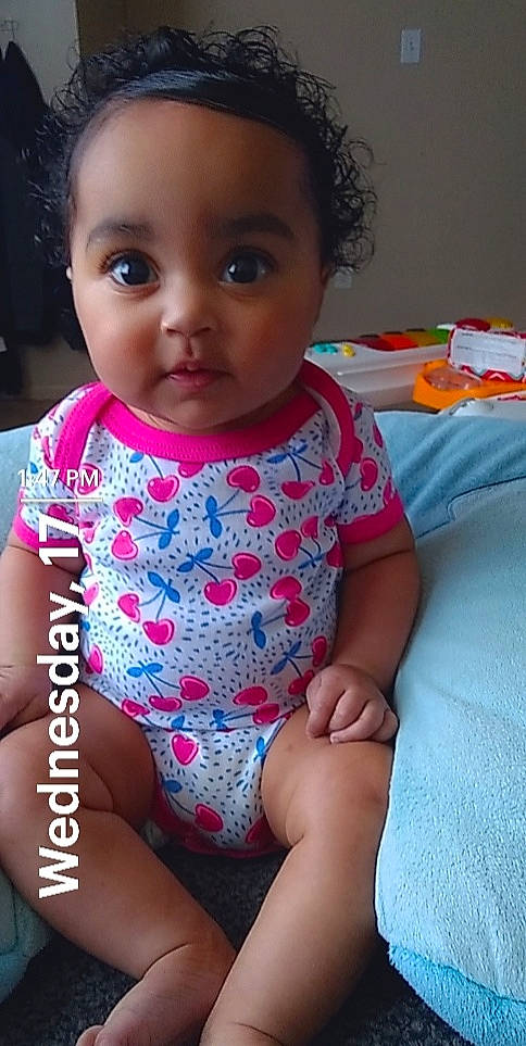 Giana is registered to the contest to win money with this photo: baby_toddler_clothing, cheek, chin, eye, eyelash, face, finger, gesture, hair, hairstyle, happy, head, iris, lip, mouth, nose, person, pink, skin, sleeve