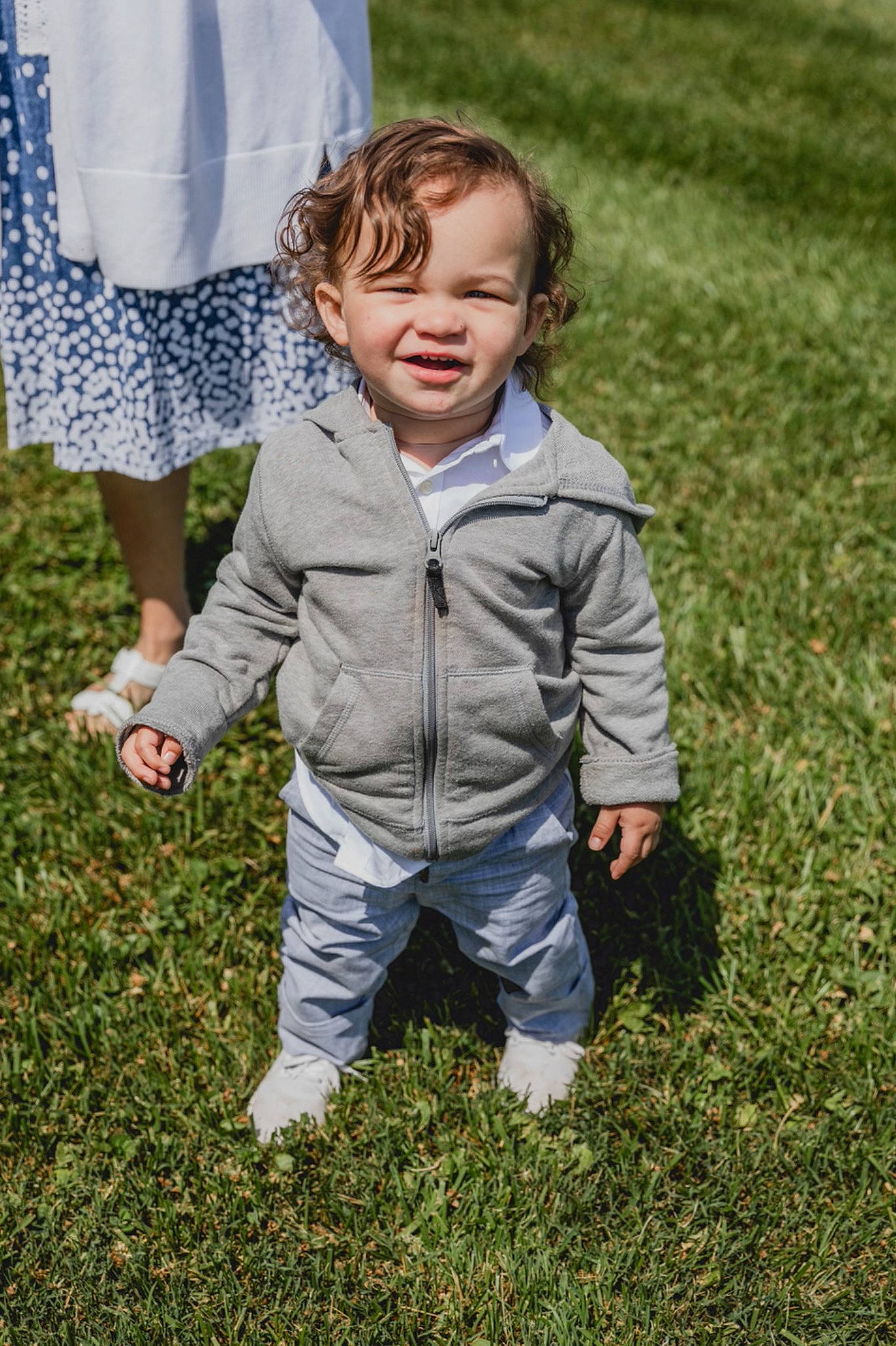 Jaxin joined the competition — help win amazing prizes! baby_toddler_clothing, child, eye, face, gesture, grass, grass_family, grassland, happy, head, jacket, lawn, mammal, meadow, people, people_in_nature, person, plant, sleeve, toddler