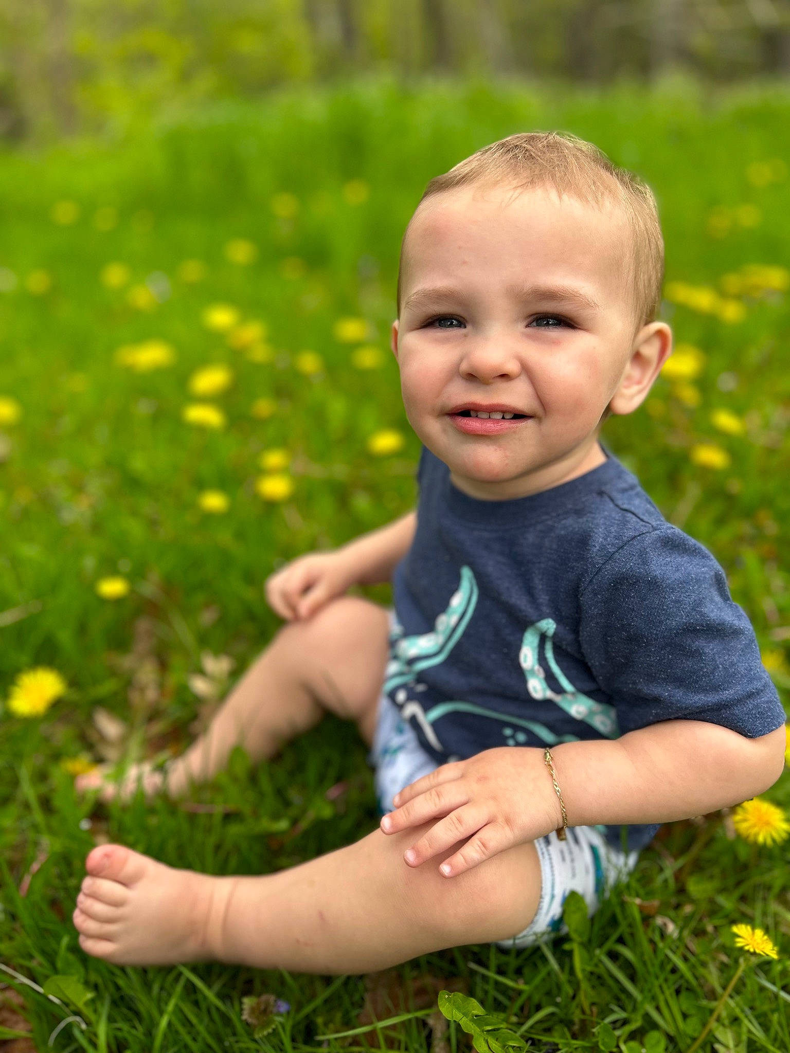 Michael is registered to the contest to win money with this photo: baby, baby_toddler_clothing, child, eye, flower, fun, grass, grass_family, grassland, happy, head, joy, leaf, meadow, people_in_nature, person, plant, skin, smile, summer