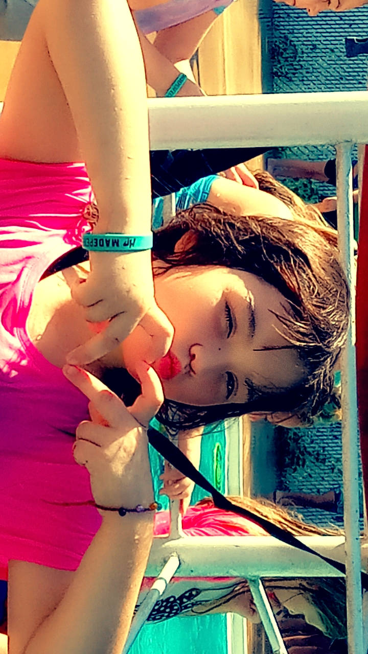 Evelyn is registered to the contest to win money with this photo: arm, bangs, black_hair, blond, brown_hair, chest, child, eyelash, fashion_design, gesture, hairstyle, hand, happy, human_body, human_leg, long_hair, person, pink, skin, thigh