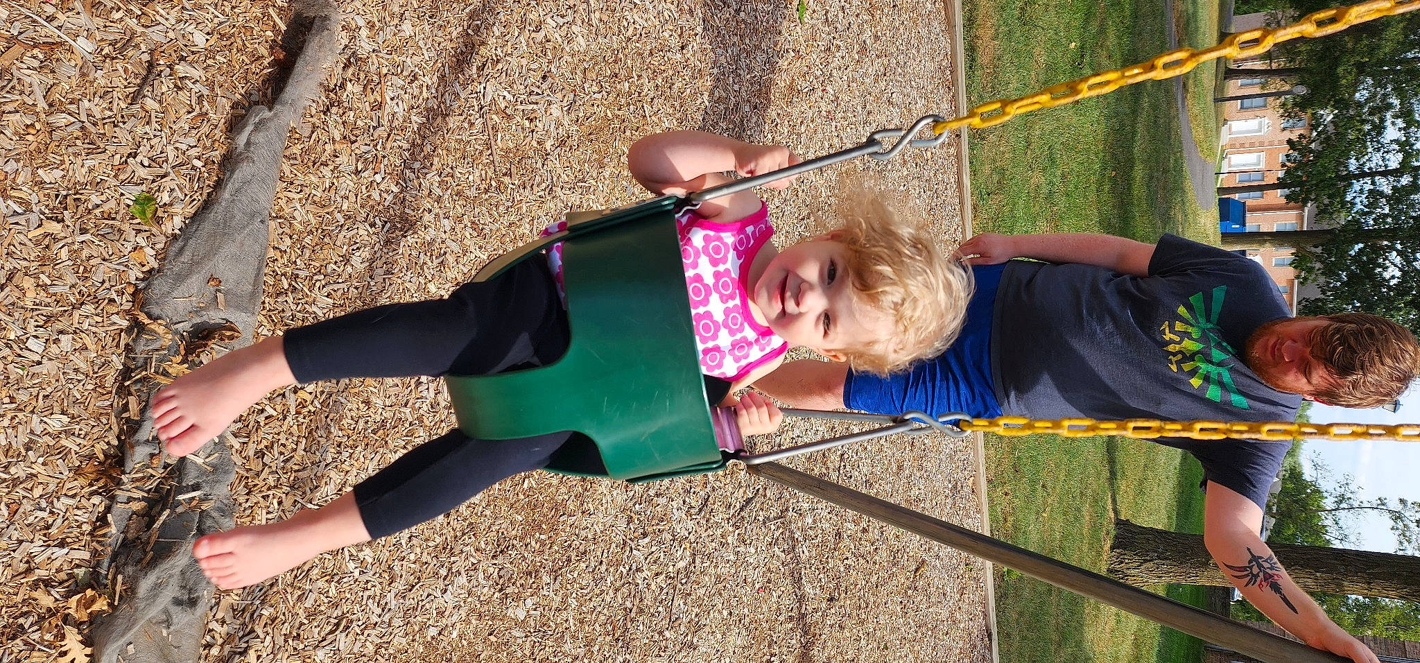 Janelle is registered to the contest to win money with this photo: child, city, fun, grass, happy, human_leg, human_settlement, joy, knee, leaf, leisure, outdoor_play_equipment, people_in_nature, person, plant, playground, recreation, smile, snapshot, thigh